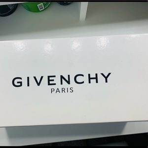 Female Givenchy tan slides.